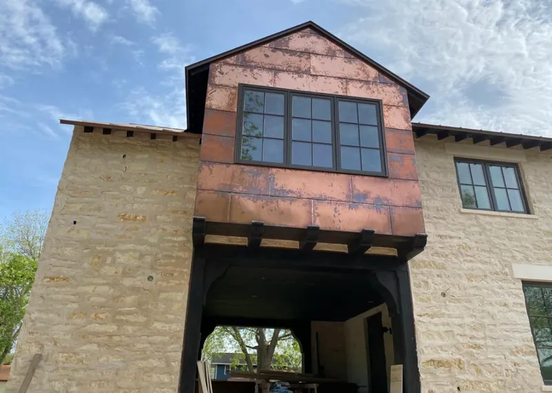 Copper metal panel facade on a stone building for Metal Roof Coating in Pleasantville